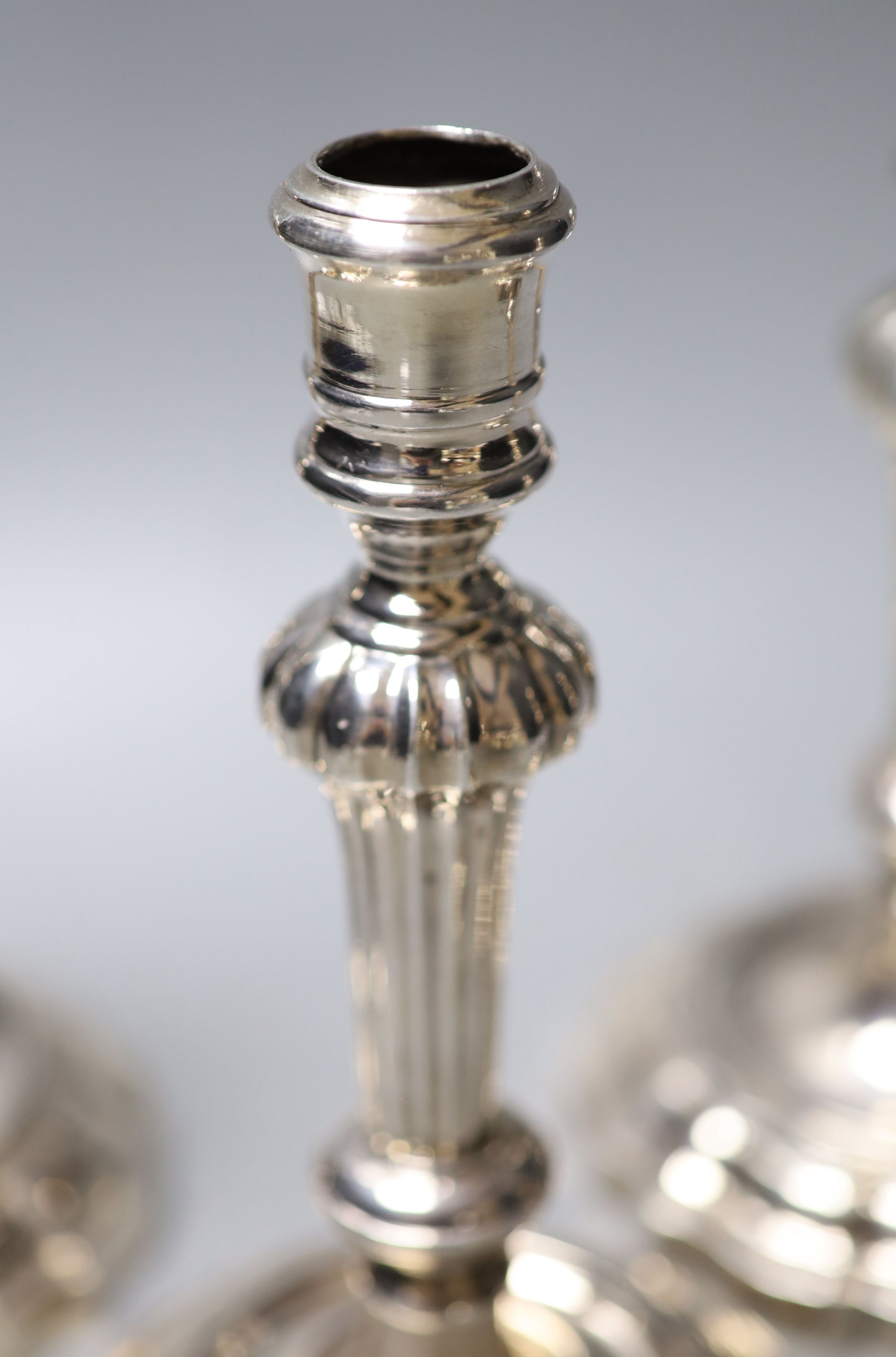 A matched set of four late 18th/early 19th century Italian? cast white metal candlesticks